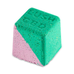 Magik. A square, light pink and green bath bomb, full of Epsom salts. "Lush CBD" is written on the top.