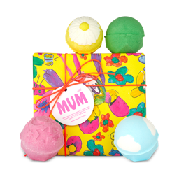 Mum. A yellow gift box decorated with flowers and butterflies sits among four bath bombs. 
