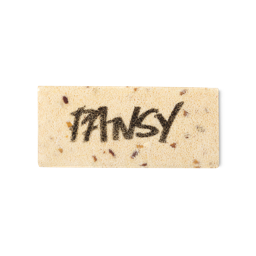 A cream coloured, rectangular washcard, consisting of apple pulp, with 'Pansy' written across it in black Lush writing.