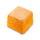 Passion Fruit Delight solid body wash. A thick, layered cube of vivid yellow/orange body wash. 