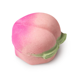 Peachy. A peach fruit-shaped bath bomb, coloured in a gradient of hot pink to peach, complete with a green leaf design.