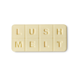 Jasmine Cream. A cream-coloured, flat, oblong wax melt segmented into 8, equal sections spelling out the words "Lush Melt".