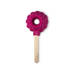 Raspberry Blower Bubble Bar. A red bumpy raspberry shape with a hole in the middle is mounted on a stick like an ice lolly.