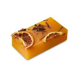 Red Rooster. A thick, oblong-shaped soap slice. It is a rich, golden-caramel colour with dried star anise, cinnamon stick and orange slices o top. 