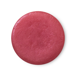 An arial view of fuchsia pink, balm-like Rose Jam solid perfume.