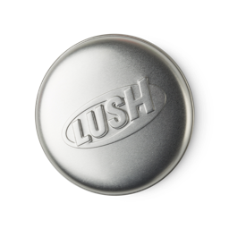 Round Tin. A round, silver metal product holder. The old-style LUSH logo is imprinted on top.