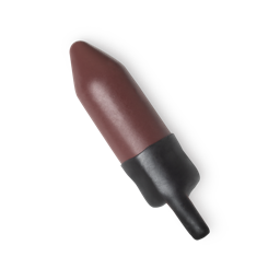 Saidoun. A rich, rusted ochre colour lipstick refill, protected by a wax outer layer, which features a tab for easy removal.