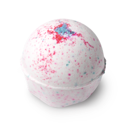 Sakura. A round bath bomb, white in colour with flecks of pink and blue, topped with a sprinkling of blue coloured coarse salt.