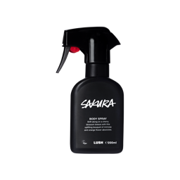 A spray bottle containing Sakura body spray, made of opaque black Lush plastic.