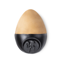 Slap Stick 14N. A medium light-neutral, warm tan coloured, egg-shaped solid foundation, with a black wax base.