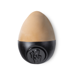 Slap Stick 19W. A medium light-warm, slightly rosy, tan coloured, egg-shaped solid foundation, with a black wax base.