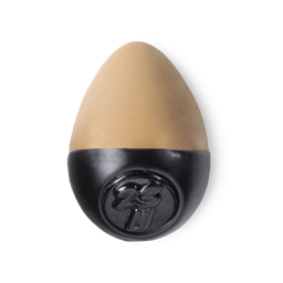 Slap Stick 23N. A medium dark-neutral, rich tan coloured, egg-shaped solid foundation, with a black wax base.
