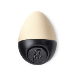 Slap Stick 3W. A light-warm, cream coloured, egg-shaped solid foundation, with a black wax base.