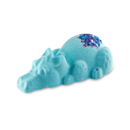 Snow Dragon. A blue bath bomb shaped like a dragon lying on its front with sparkly purple and blue popping candy on top.