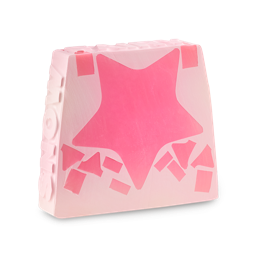 Snow Fairy. A trapezium-shaped, light pink soap. There is one large dark pink star through the middle with scattered patches. The word "SNOW" is embossed on the side of the soap and "FAIRY" is across the top. 