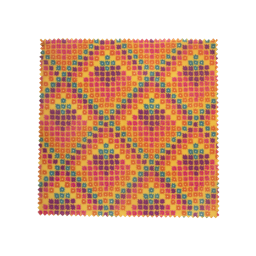A geometrically patterned wax wrap is laid out flat, next to a wax-wrapped soap, and another wrap in its brown card packaging.