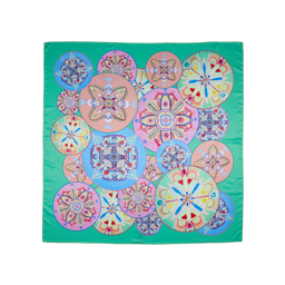 Star of Youth. A square, green knot wrap with circular shapes featuring symmetrical patterns. 