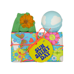 Sun Shiny Day. A colourful, groovy, wrapped gift box with two Mother's Day bath bombs sat on top. 