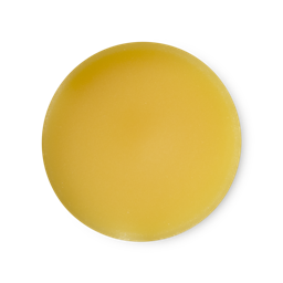 An arial view of rich, sunny yellow, balm-like Sun solid perfume.
