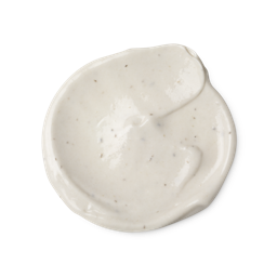 A swatch of light cream coloured Sympathy for the Skin body lotion, with tiny dark brown flecks, which are vanilla pod seeds.