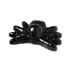 Tarantula shower jelly, a shiny black jelly spider with a smiley face.