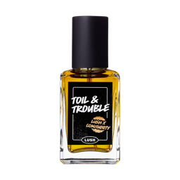Toil and Trouble. The classic LUSH glass perfume bottle with a black lid and a sticker printed with "Toil and Trouble".