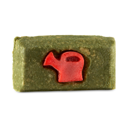 True Grit. A rectangular, grass-green soap bar with a bright red watering can embossed on the front.