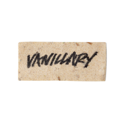 A cream coloured, rectangular washcard, consisting of apple pulp, with 'Vanillary' written across it in black Lush writing.