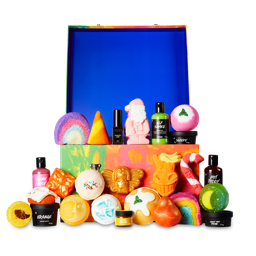 Lush Advent Calendar. The box has blue lid open, 25 products are displayed around the green, yellow, orange sides of the box.