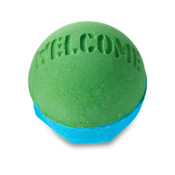 Welcome bath bomb. A round bath bomb with a deep-blue base and bright-green top and the word "Welcome" embossed on top.