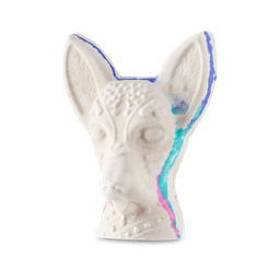 Xolo. A playful, Dia Des Muertos bath bomb shaped like the face of a Xoloitzcuintle, or Mexican Hairless dog. It is a white bath bomb with flashed of blue and pink around the edges.